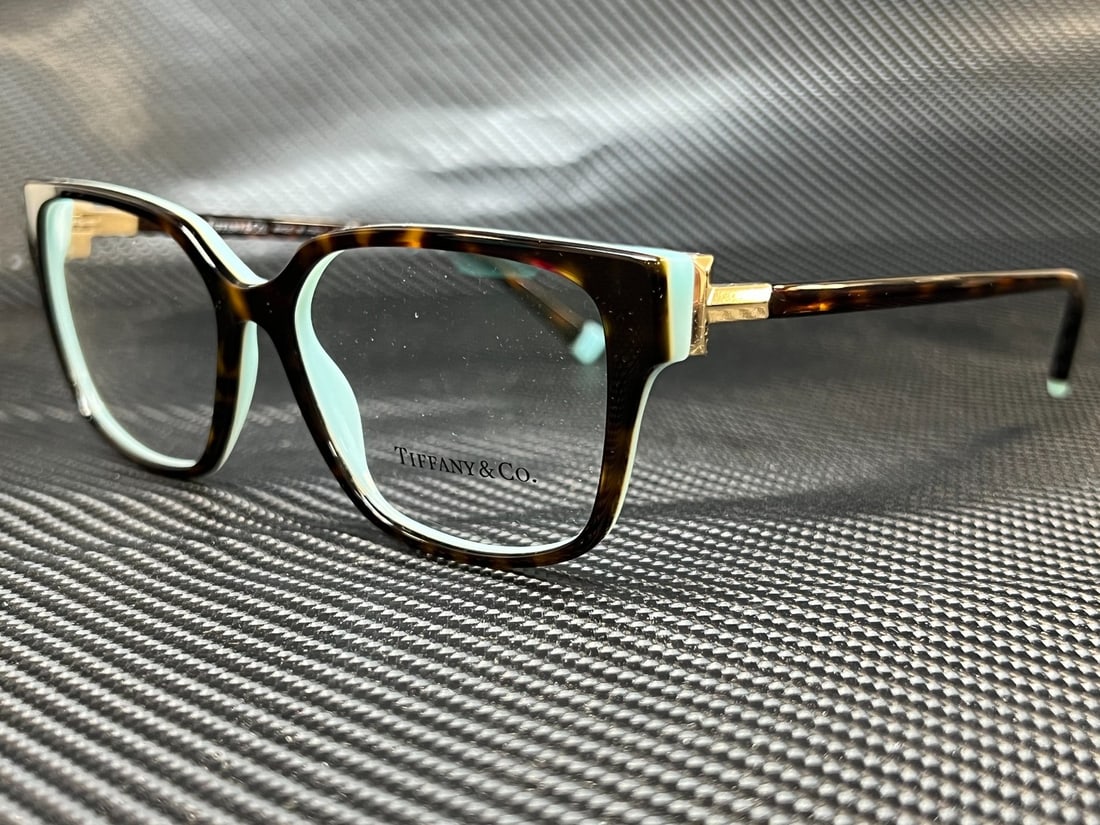Tiffany & Co. TF2197 8134 Havana Demo Lens Eyeglasses with Authenticity: Tiffany & Co. TF2197 8134 Havana Demo Lens Eyeglasses with Authenticity Enhance your vision with the Tiffany TF2197 8134 Havana Demo Lens Women's Eyeglasses. Crafted with elegance, these eyeglasses fe