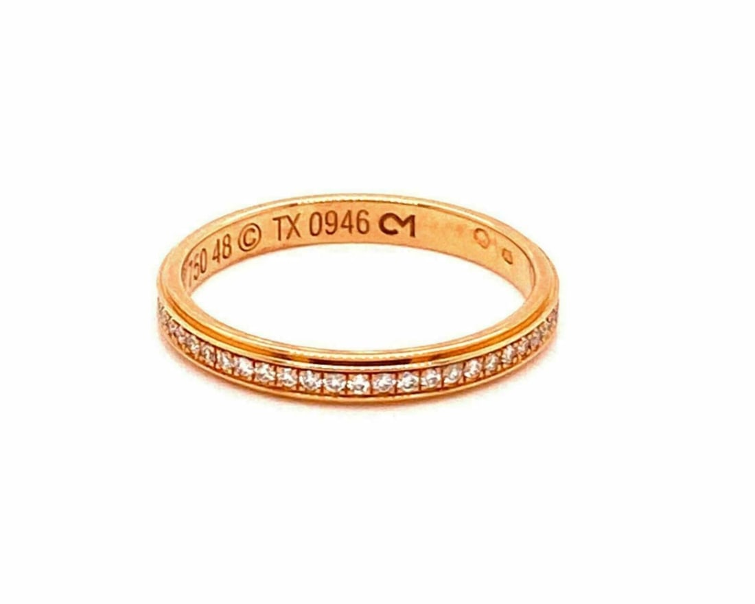 Cartier Diamond d'Amour Rose Gold 18k Band Ring Size 4.5 with Certificate: Cartier Diamond d'Amour Rose Gold 18k Band Ring Size 4.5 with Certificate This Cartier Diamond d'Amour band ring is crafted from 18k rose gold and features a central natural diamond totaling 0.15ct. T