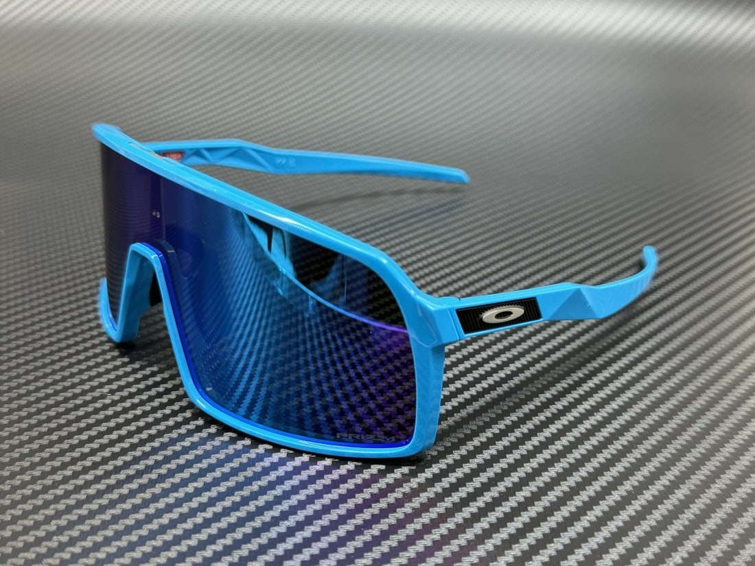 Oakley OO9406 07 Sky Blue Prizm Sapphire 70mm Sunglasses: Oakley OO9406 07 Sky Blue Prizm Sapphire 70mm Sunglasses Discover the Oakley OO9406 07 Sky Prizm Sapphire Sunglasses, perfect for any unisex wearer. These stylish shield sunglasses feature a vibrant s