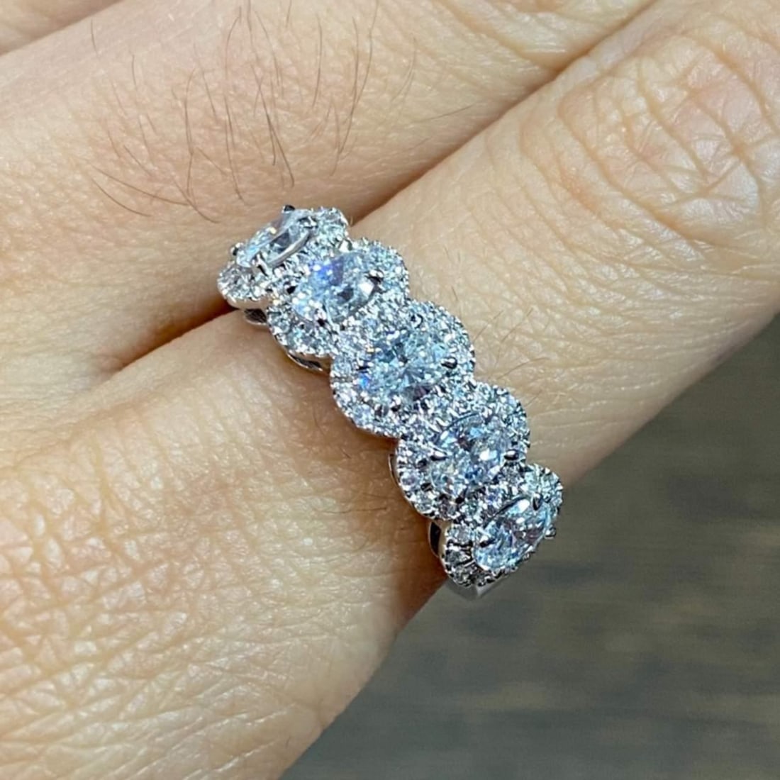 14K White Gold 1.65 Ct Diamond Anniversary Ring with 63 Diamonds: 14K White Gold 1.65 Ct Diamond Anniversary Ring with 63 Diamonds This exquisite 14K White Gold Anniversary Band features a stunning total diamond weight of approximately 1.65 carats. It showcases 5 pr