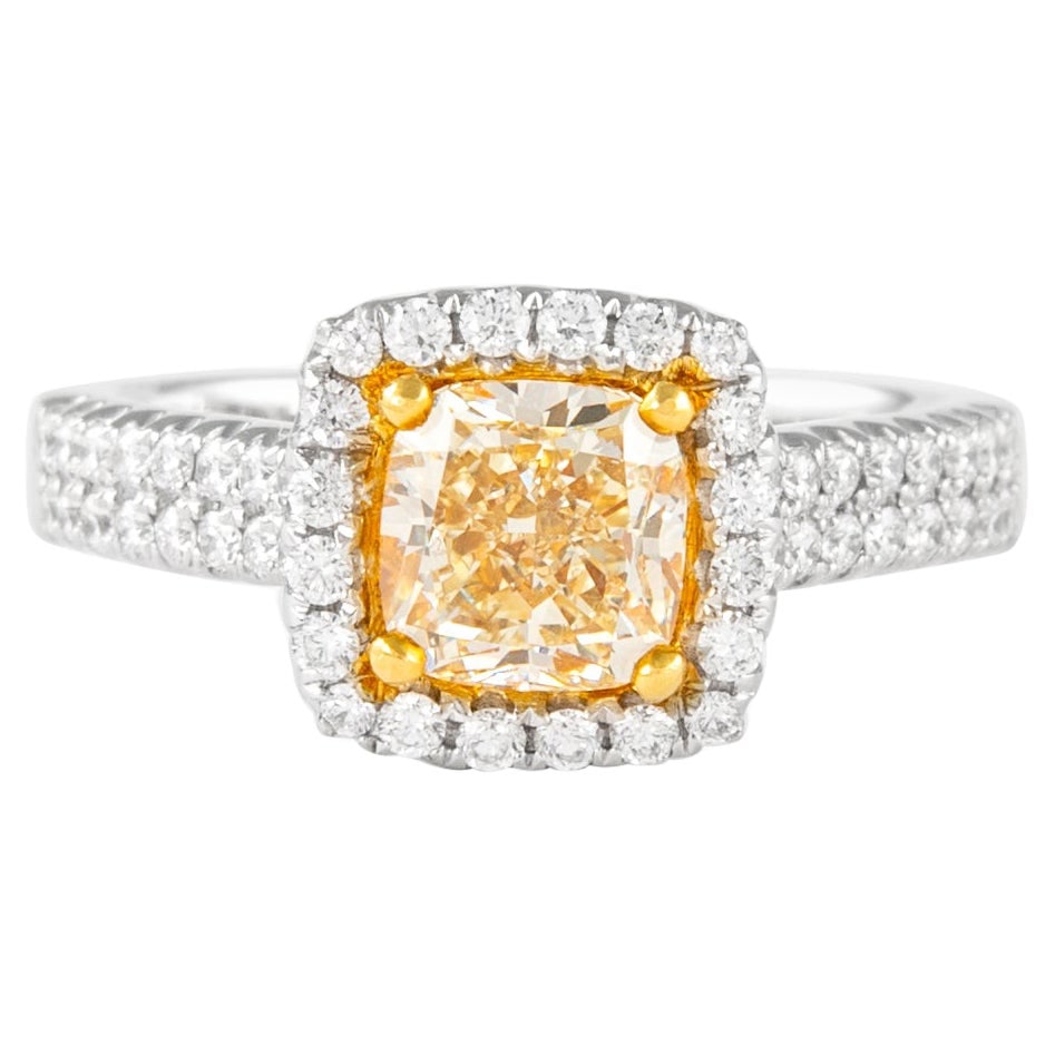 1.41ct Fancy Intense Yellow VVS2 Diamond Halo Ring EGL Certified: 1.41ct Fancy Intense Yellow VVS2 Diamond Halo Ring EGL Certified This exquisite halo ring features a stunning 1.41 carat Fancy Intense Yellow diamond, graded VVS2 for clarity. The diamond is elegantly