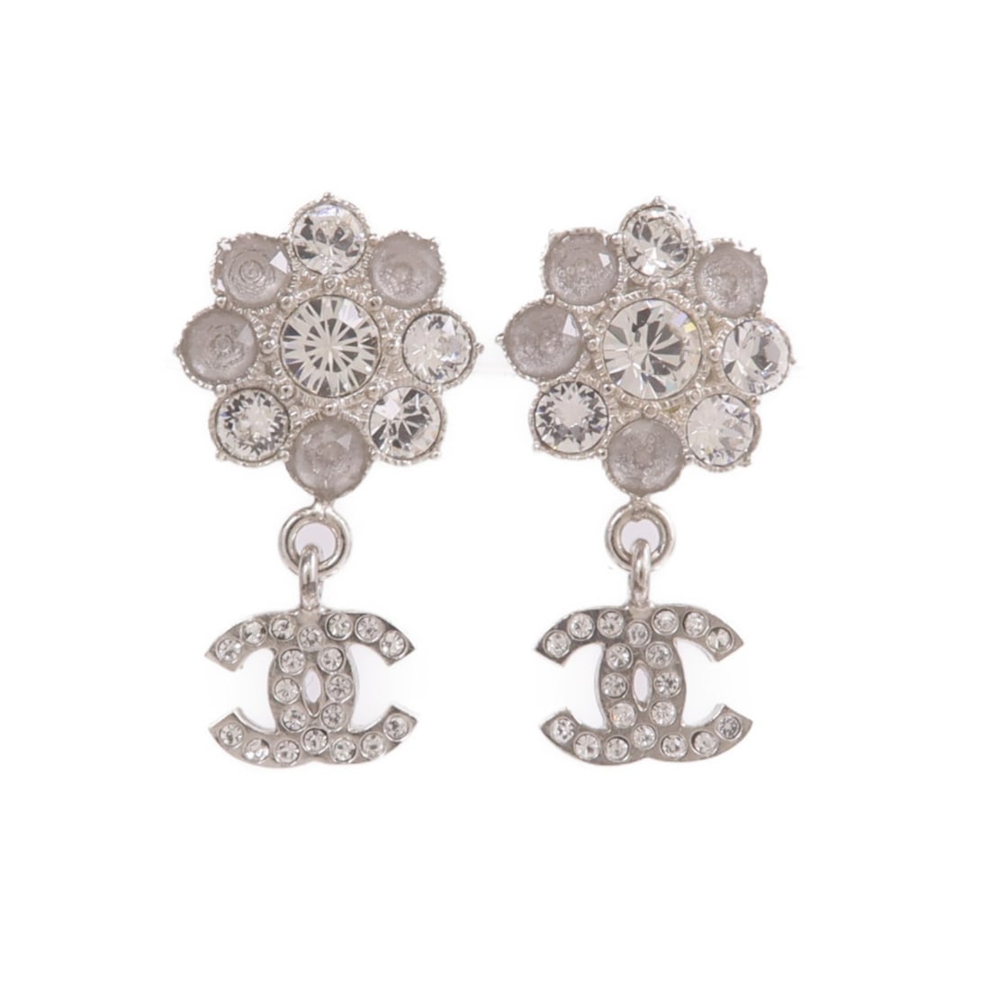 CHANEL Silver Tone CC Logo Pierced Earrings for Women: CHANEL Silver Tone CC Logo Pierced Earrings for Women These CHANEL CC earrings feature a classic pierced design crafted in silver-tone metal. Designed for women, these earrings do not include any gems