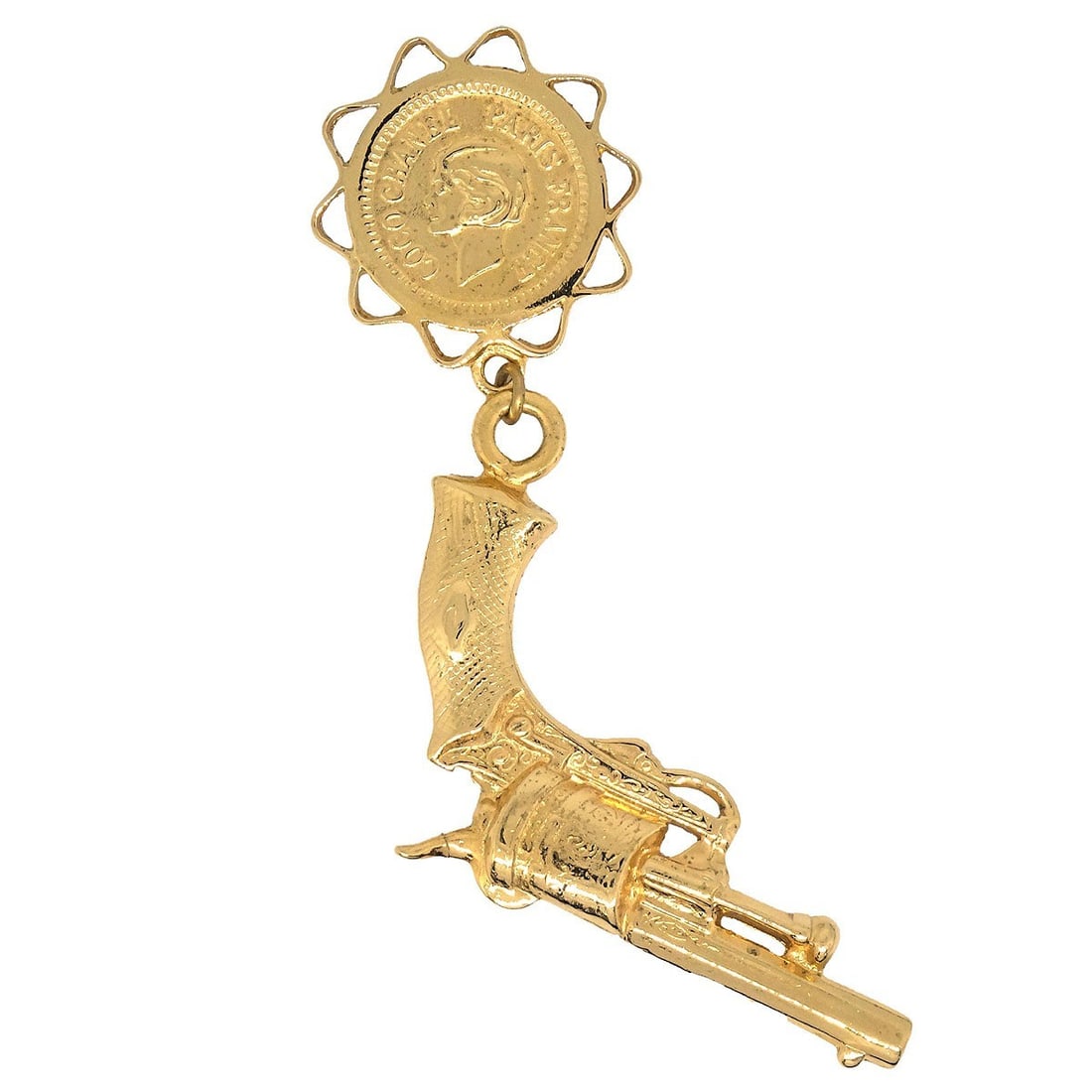 Gold Plated Gun Shaped Brooch by Chanel: Gold Plated Gun Shaped Brooch by Chanel This Chanel brooch features a unique gun motif in a gold-plated finish. The piece showcases the brand's distinctive style and adds a bold statement to any ensem