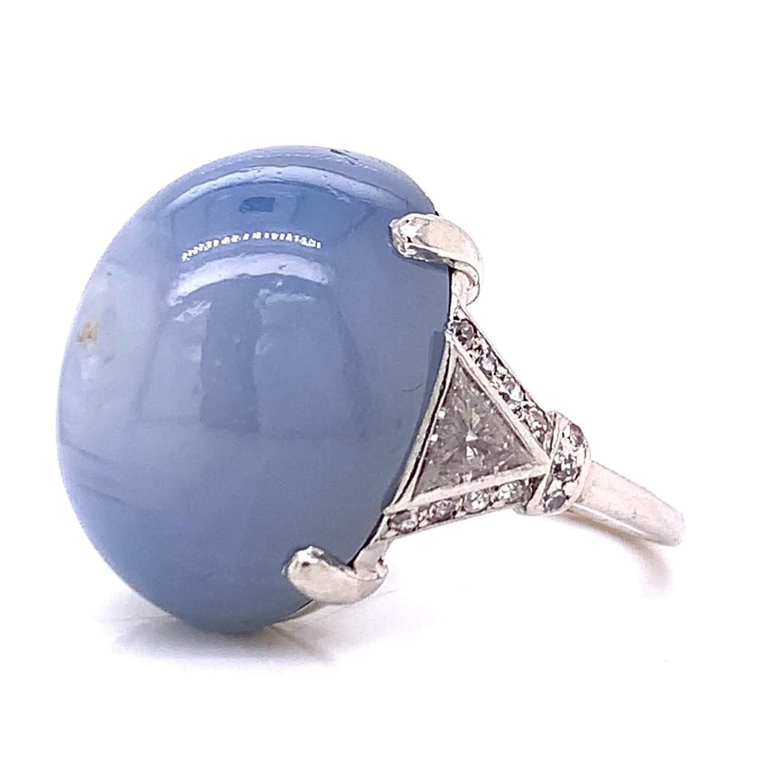 Vintage Art Deco Platinum Star Sapphire Diamond Ring 35.45 Ct: Vintage Art Deco Platinum Star Sapphire Diamond Ring 35.45 Ct This exquisite Art Deco ring showcases a stunning 35.45 Ct. star sapphire, elegantly complemented by approximately 1.25 Ct. of diamonds. C