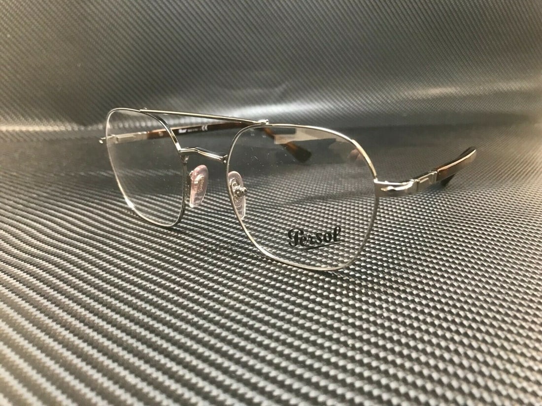 Persol PO2483V 513 Gunmetal Rectangle Eyeglasses 50mm Demo Lenses: Persol PO2483V 513 Gunmetal Rectangle Eyeglasses 50mm Demo Lenses Discover the elegance of Persol PO2483V 513 eyeglasses, designed with a sophisticated rectangular frame in a stylish gunmetal finish.