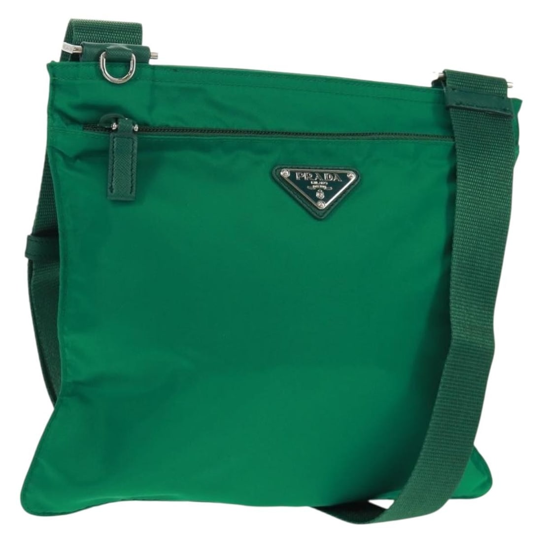 Green Nylon Prada Shoulder Bag With Silver Accents and Dust Bag: Green Nylon Prada Shoulder Bag With Silver Accents and Dust Bag This PRADA shoulder bag is crafted from green nylon with silver-tone accents and is designed for women. It features an adjustable should
