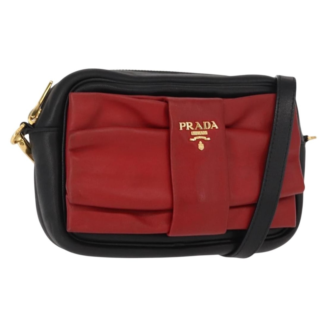 Prada Black Leather Shoulder Bag with Gold Accents and Dust Bag: Prada Black Leather Shoulder Bag with Gold Accents and Dust Bag This PRADA shoulder bag is crafted from black leather with gold-tone accents and features a compact silhouette. The bag includes a shoul