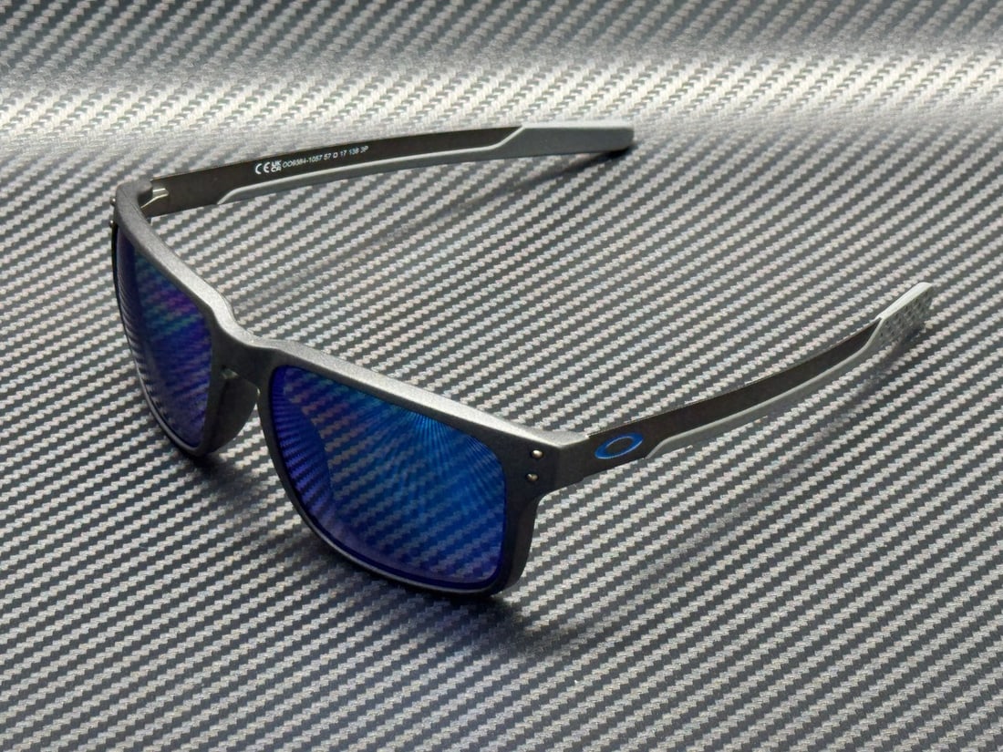 Oakley Holbrook Mix Steel Gray 57mm Prizm Sapphire Polarized Sunglasses: Oakley Holbrook Mix Steel Gray 57mm Prizm Sapphire Polarized Sunglasses These Oakley Holbrook Mix sunglasses feature a rectangular design with a steel gray plastic frame and blue Prizm Sapphire Iridiu