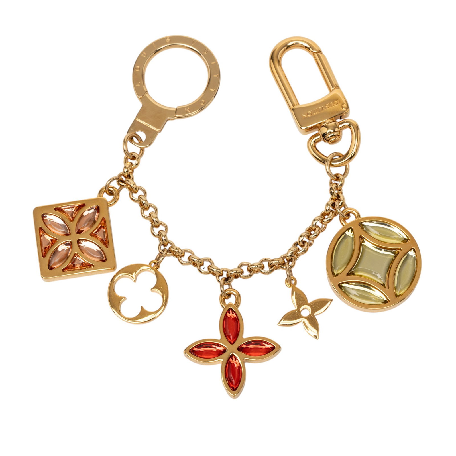 Monogram Ice Flower Charm by Louis Vuitton Gold Tone Metal Keychain: Monogram Ice Flower Charm by Louis Vuitton Gold Tone Metal Keychain This Louis Vuitton Monogram Ice Flower bag charm features a gold-tone metal body adorned with monogram charms. It is designed with a