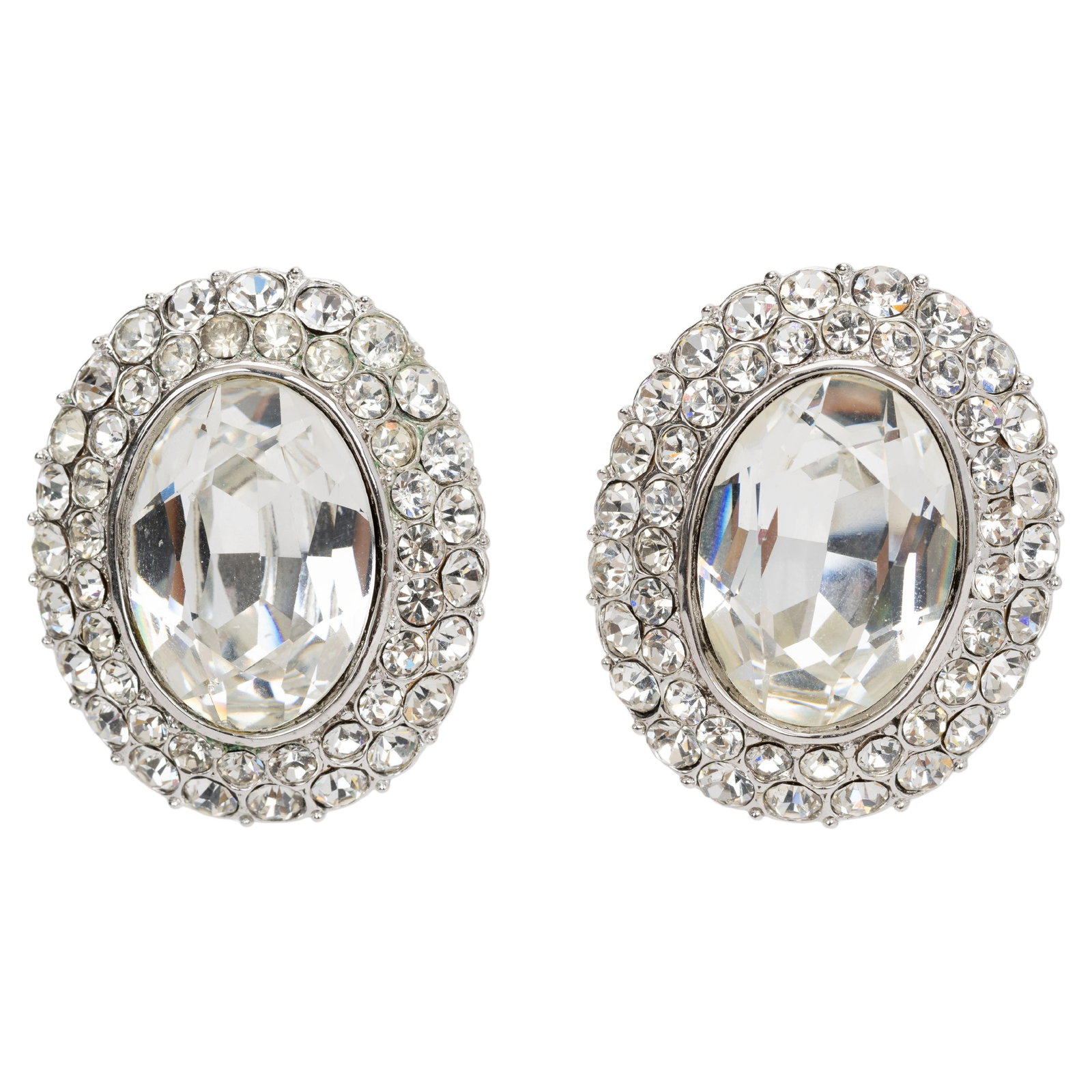 Yves Saint Laurent 1989 Clip-on Crystal Earrings with Velvet Pouch: Yves Saint Laurent 1989 Clip-on Crystal Earrings with Velvet Pouch Enhance your accessory collection with these stunning Yves Saint Laurent Clip Crystal Earrings. Crafted from base metal, these earrin