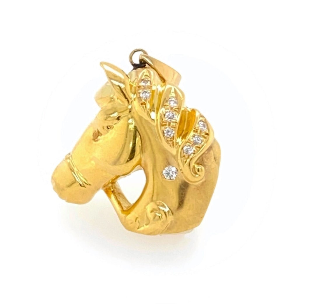 Vintage 18k Yellow Gold Horse Head Pendant with Diamond Accent: Vintage 18k Yellow Gold Horse Head Pendant with Diamond Accent This vintage pendant features a finely crafted horse head design, set in 18k yellow gold and accented with a 0.10 ct diamond. Signed by t