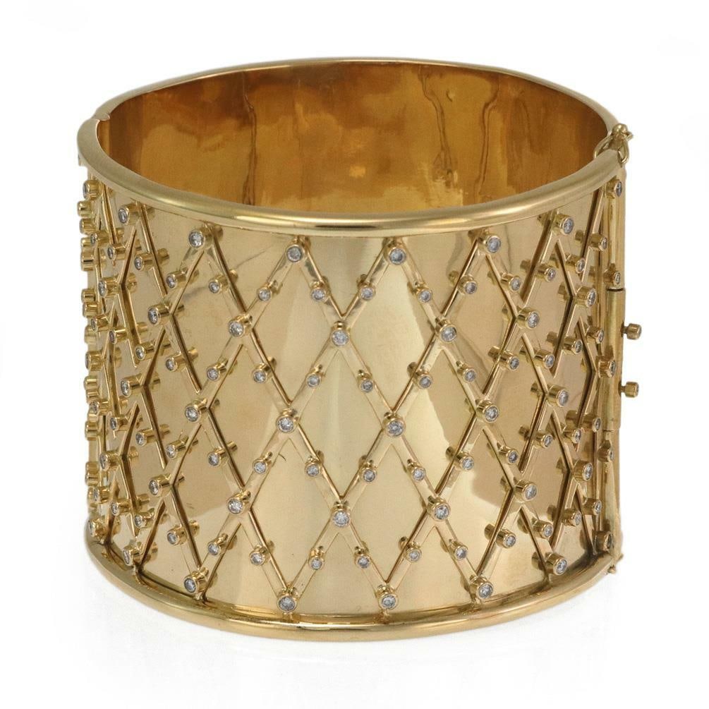 Elegant 5.5ct Diamond 18k Yellow Gold 2.20 Inch Wide Bracelet: Elegant 5.5ct Diamond 18k Yellow Gold 2.20 Inch Wide Bracelet This stunning estate bracelet features a striking 2.20-inch wide band crafted from high-polished 18k yellow gold. The design showcases rho