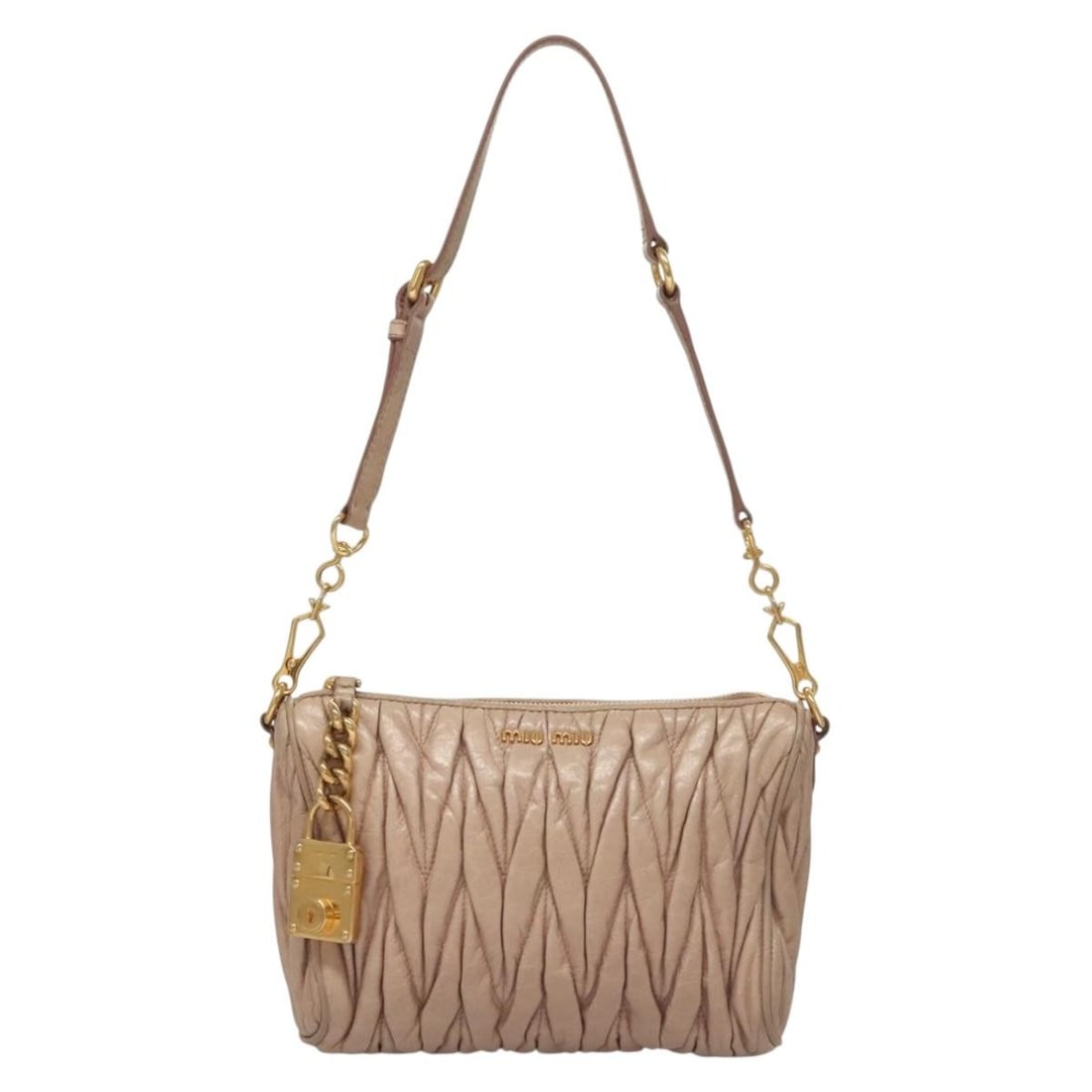 Pink Matelasse Leather Crossbody with Zip by Miu Miu: Pink Matelasse Leather Crossbody with Zip by Miu Miu This Miu Miu Zip Crossbody Bag features a matelasse leather exterior in pink, designed for women. The bag offers a compact silhouette and comes wit