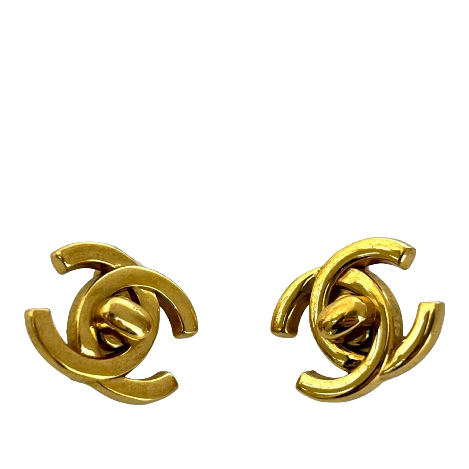 Chanel CC Logo Gold Plated Clip On Earrings with Turn Lock: Chanel CC Logo Gold Plated Clip On Earrings with Turn Lock These Chanel CC earrings feature gold-plated metal bodies with a signature turn lock design and clip-on closures. Made in France, these costu