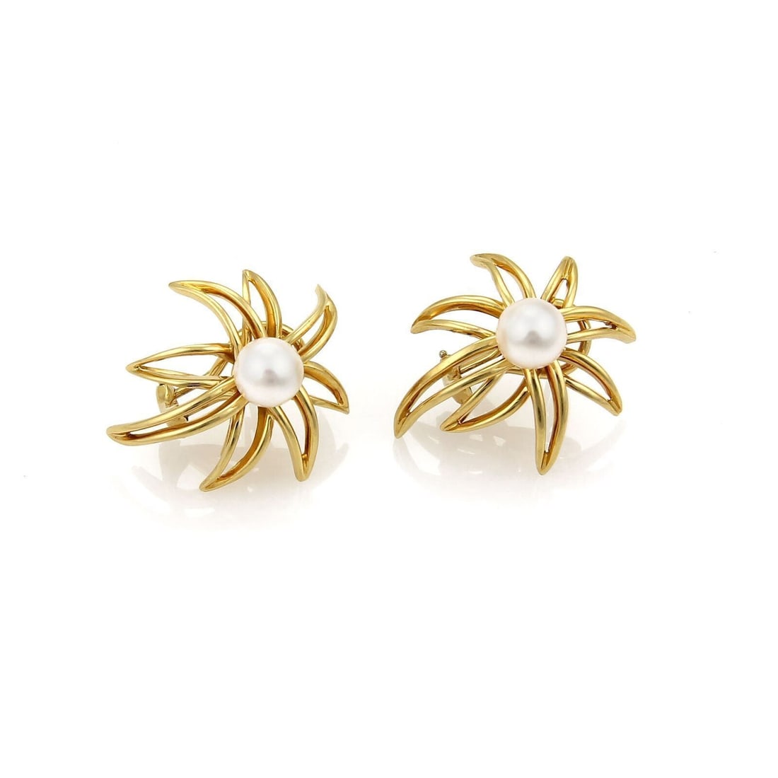 Fireworks Pearl Stud Earrings in 18k Yellow Gold by Tiffany & Co.: Fireworks Pearl Stud Earrings in 18k Yellow Gold by Tiffany & Co. These Tiffany & Co. Fireworks Pearls earrings are crafted from 18k yellow gold and feature a post and clip back design. Each earring i