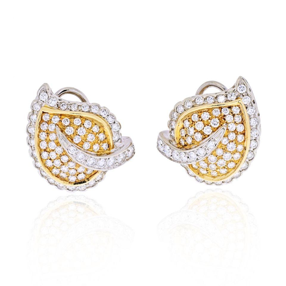 18K White Gold Leaf Motif Earrings with 4.50 Carats of Diamonds: 18K White Gold Leaf Motif Earrings with 4.50 Carats of Diamonds These stunning earrings feature a beautiful leaf motif crafted in 18K white gold. They showcase an impressive total diamond weight of 4.