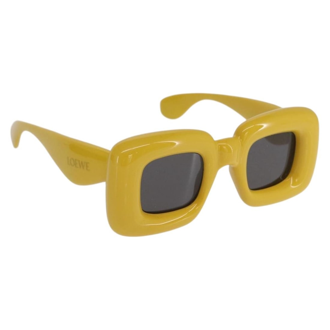 Yellow Plastic Sunglasses by Loewe with Case Italy: Yellow Plastic Sunglasses by Loewe with Case Italy These LOEWE sunglasses feature a stylish yellow plastic frame, offering a modern look with a vibrant touch. Crafted in Italy, they are in un-used con