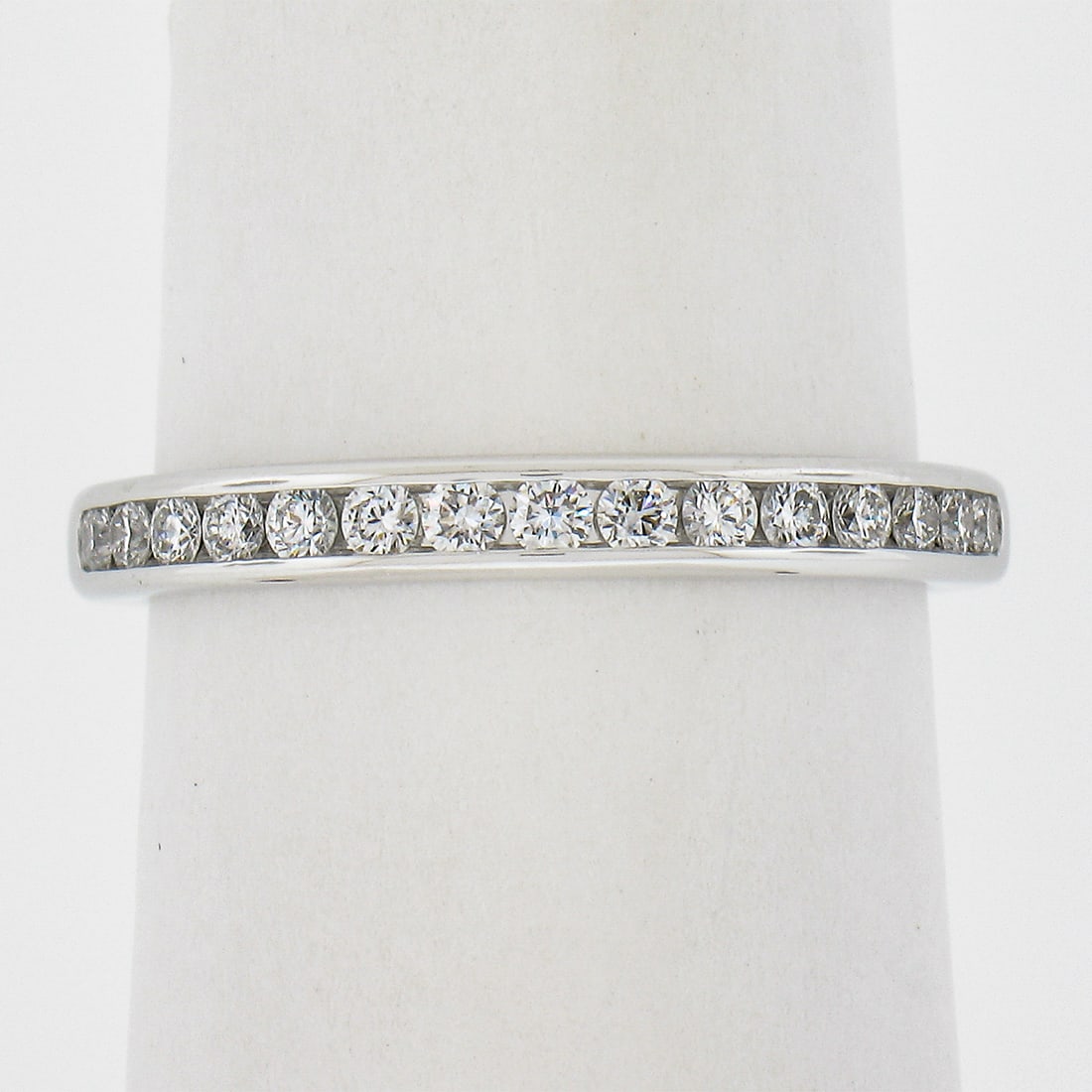 Tiffany & Co. 0.30ct Platinum Channel Set Diamond Wedding Band Ring: Tiffany & Co. 0.30ct Platinum Channel Set Diamond Wedding Band Ring This exquisite Tiffany & Co. wedding band ring features a channel-set design adorned with 15 natural, round brilliant cut diamonds, 