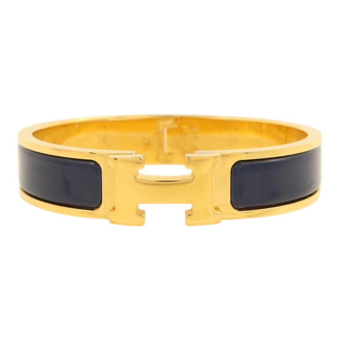 Hermes Clic H Navy Enamel and Gold Tone Bracelet for Women: Hermes Clic H Navy Enamel and Gold Tone Bracelet for Women This Hermes Clic H bracelet features a navy enamel exterior accented with gold-tone metal. Designed for women, it combines classic style with