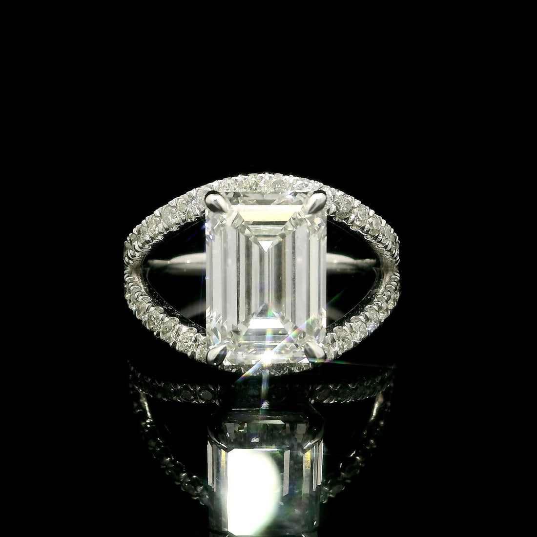 14k White Gold GIA 5.3ctw Emerald Cut Lab Grown Diamond Ring: 14k White Gold GIA 5.3ctw Emerald Cut Lab Grown Diamond Ring This stunning cocktail ring features a breathtaking 4.90ct emerald cut lab-grown diamond, certified by GIA, with a G color grade and VS2 cl