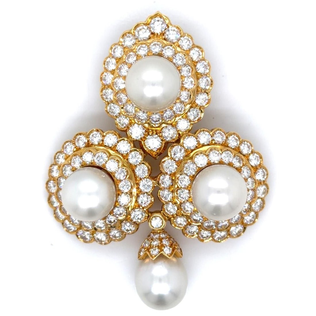 Brooch in 18K Yellow Gold with Four South Sea Pearls and Diamonds: Brooch in 18K Yellow Gold with Four South Sea Pearls and Diamonds This brooch is crafted from 18K yellow gold and features four South Sea pearls measuring between 13.5 mm and 10.7 mm. It is adorned wi