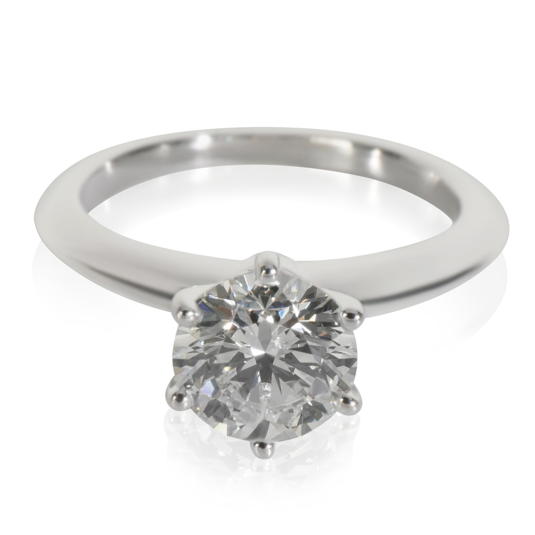 Platinum Engagement Ring with 1.28ct Round Diamond and Tiffany Certificate: Platinum Engagement Ring with 1.28ct Round Diamond and Tiffany Certificate This Tiffany & Co. engagement ring features a 1.28 carat round brilliant diamond set in platinum. The diamond has an H color 