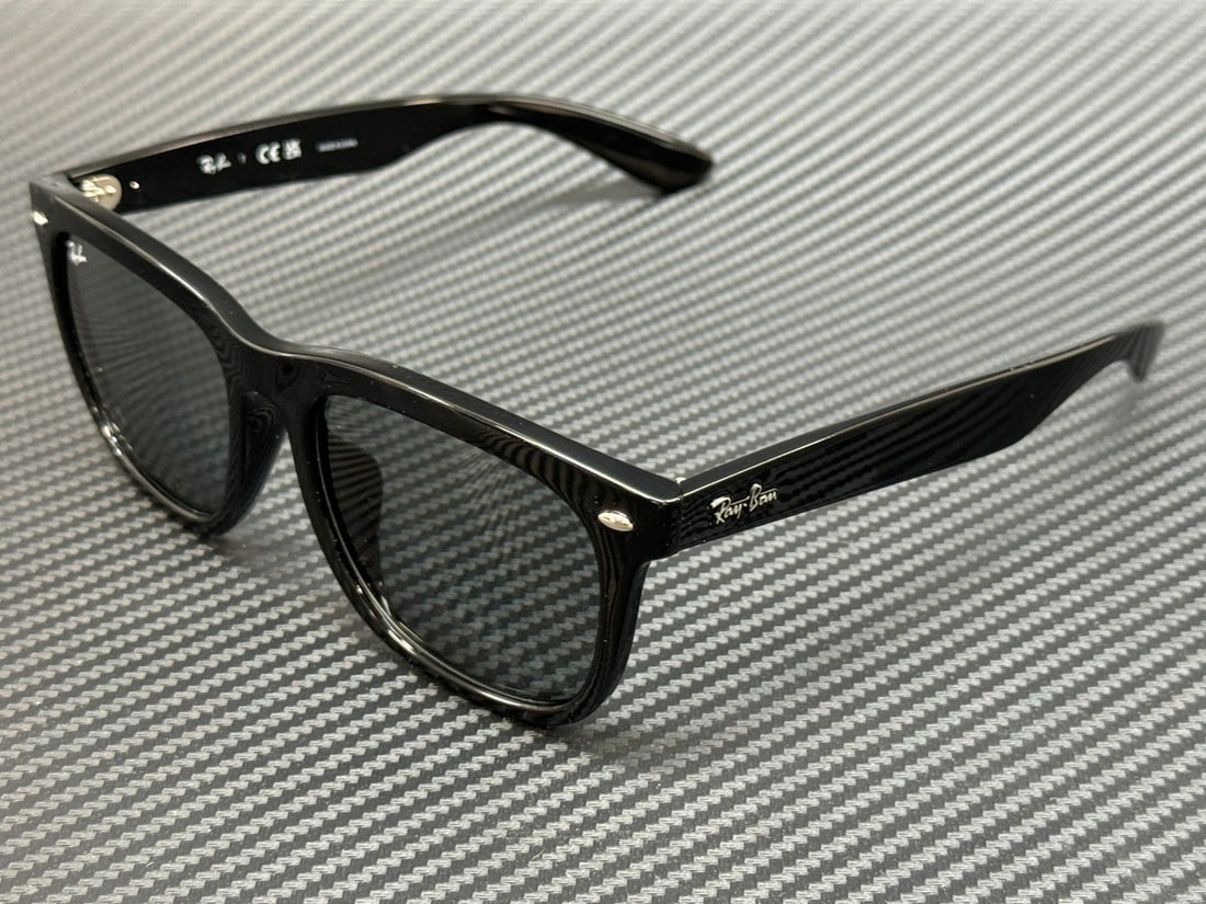 Ray-Ban RB4260D 601 1 Black Grey 57mm Sunglasses with Authenticity Certificate: Ray-Ban RB4260D 601 1 Black Grey 57mm Sunglasses with Authenticity Certificate Elevate your style with these Ray-Ban RB4260D sunglasses, featuring a sleek black frame and grey lenses. Designed for bot