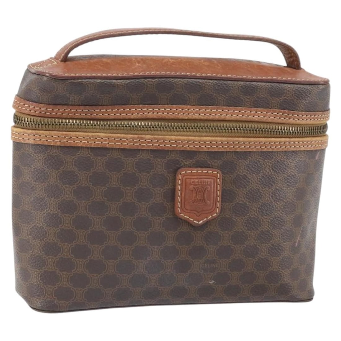 CELINE Brown Gold Macadam Canvas PVC Leather Handbag Italy BA10609: CELINE Brown Gold Macadam Canvas PVC Leather Handbag Italy BA10609 This CELINE handbag features a combination of brown Macadam canvas and PVC leather with gold-tone metal fittings. It is crafted in It