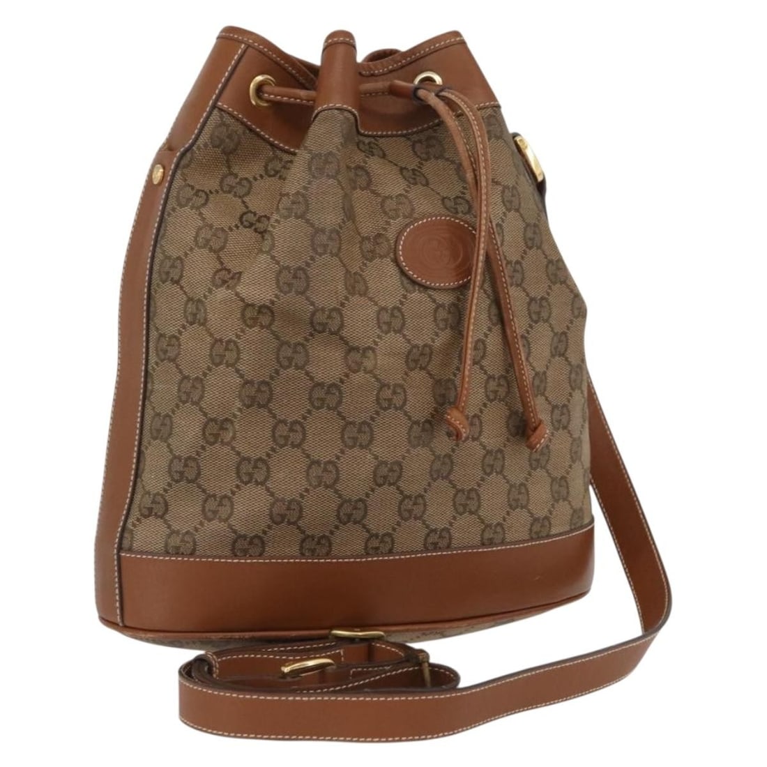 Beige Gold GG Canvas Shoulder Bag by Gucci Italy: Beige Gold GG Canvas Shoulder Bag by Gucci Italy This is a women's GUCCI GG Canvas shoulder bag in beige and gold tones, crafted in Italy. The bag features the iconic GG canvas material, gold accents,