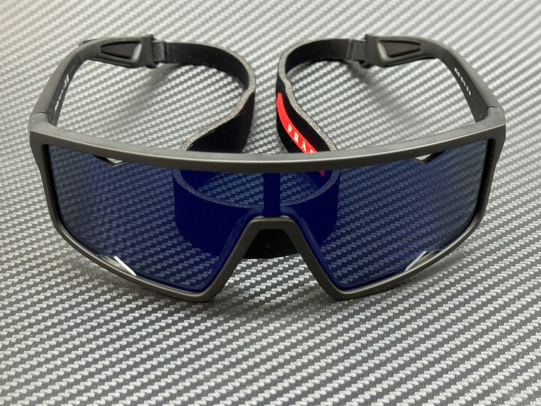 Prada Linea Rossa PS A03S 1BO10J Matte Black 70mm Sunglasses with Dark Blue Violet Mirror: Prada Linea Rossa PS A03S 1BO10J Matte Black 70mm Sunglasses with Dark Blue Violet Mirror Elevate your eyewear collection with these PRADA LINEA ROSSA PS A03S 1BO10J sunglasses. Featuring a sleek matt