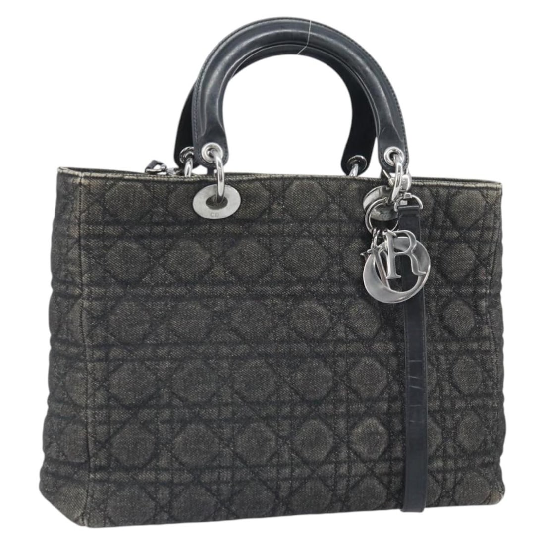 Christian Dior Lady Dior Black Canvas Tote with Shoulder Strap and Charm: Christian Dior Lady Dior Black Canvas Tote with Shoulder Strap and Charm This Christian Dior Lady Dior Canage tote bag features a black and silver canvas exterior with silver-tone accents. Designed wi