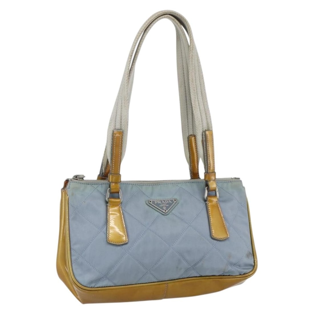 Light Blue Nylon PRADA Tote Bag with Silver Accents and Guarantee Card: Light Blue Nylon PRADA Tote Bag with Silver Accents and Guarantee Card This PRADA tote bag features a light blue and silver nylon exterior with a structured silhouette. The bag is designed with dual h