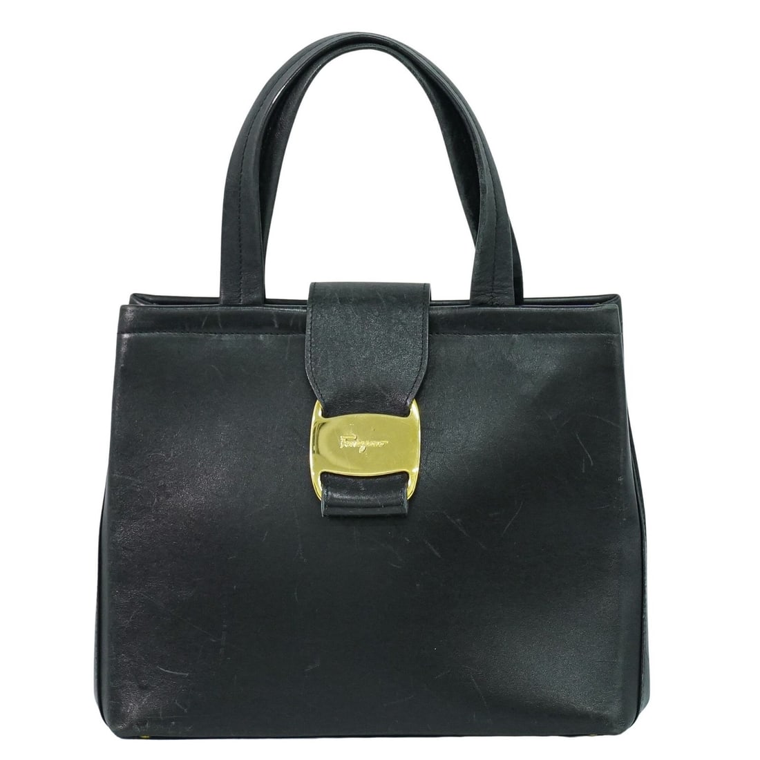 Black Leather Salvatore Ferragamo Vala Purse 24cm by 20cm by 11cm: Black Leather Salvatore Ferragamo Vala Purse 24cm by 20cm by 11cm This Salvatore Ferragamo Vala handbag is crafted from black leather and designed for female use. It shows signs of wear including body