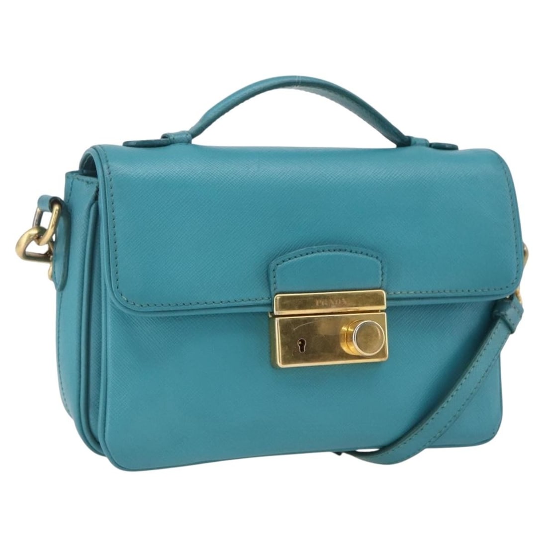 Prada Saffiano Leather Light Blue Two Way Handbag with Shoulder Strap: Prada Saffiano Leather Light Blue Two Way Handbag with Shoulder Strap This Prada handbag is crafted from Saffiano leather in a light blue color with gold-tone accents. Designed as a 2-way bag, it feat