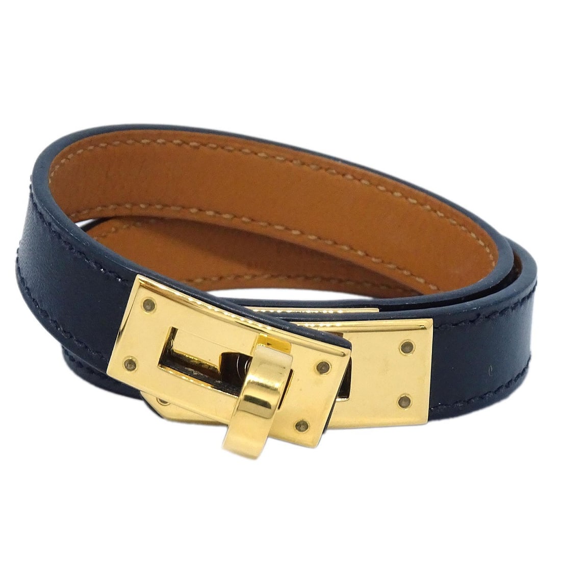 Kelly Double Tour Leather Bangle Bracelet in Black by Hermes: Kelly Double Tour Leather Bangle Bracelet in Black by Hermes This Hermes Kelly Double Tour bracelet is crafted from black box calf leather in a round bangle style. Made in France, it features a sleek