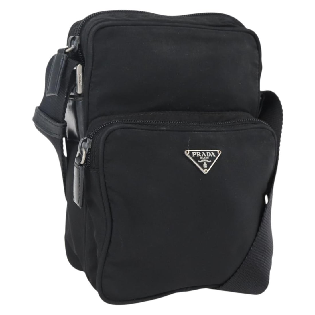 Black and Silver Nylon Shoulder Bag by Prada Italy: Black and Silver Nylon Shoulder Bag by Prada Italy This is a PRADA shoulder bag crafted from silver and black nylon. The bag features a main compartment with a shoulder strap that is adjustable in len