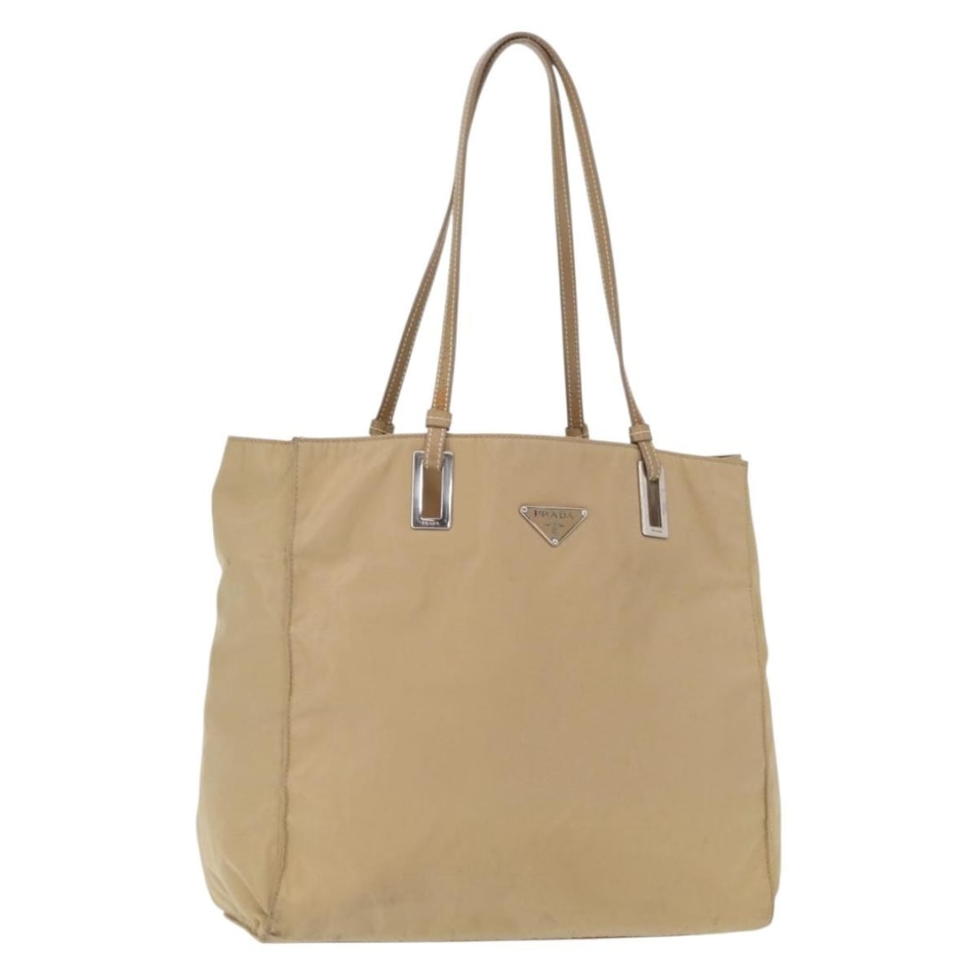 Prada Beige Nylon and Leather Tote Bag with Silver Accents: Prada Beige Nylon and Leather Tote Bag with Silver Accents This is a PRADA tote bag crafted from beige nylon with leather accents and silver-tone details. Made in Italy, the bag features a spacious in