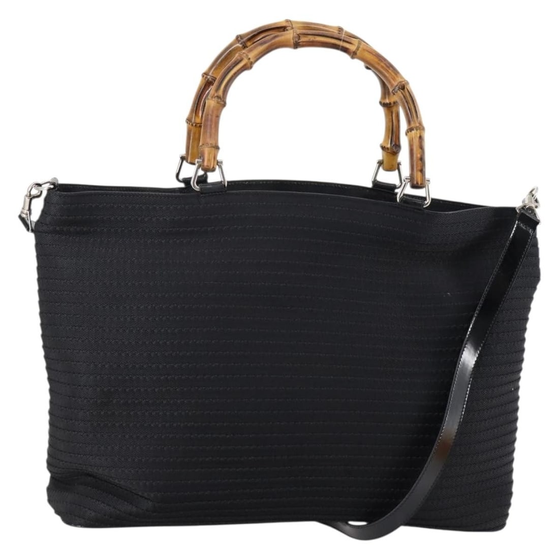 GUCCI Black Nylon Bamboo Hand Bag 2way Made in Italy: GUCCI Black Nylon Bamboo Hand Bag 2way Made in Italy This authentic GUCCI Bamboo Hand Bag is crafted from durable black nylon, exuding a chic yet practical style. With a spacious design measuring appr