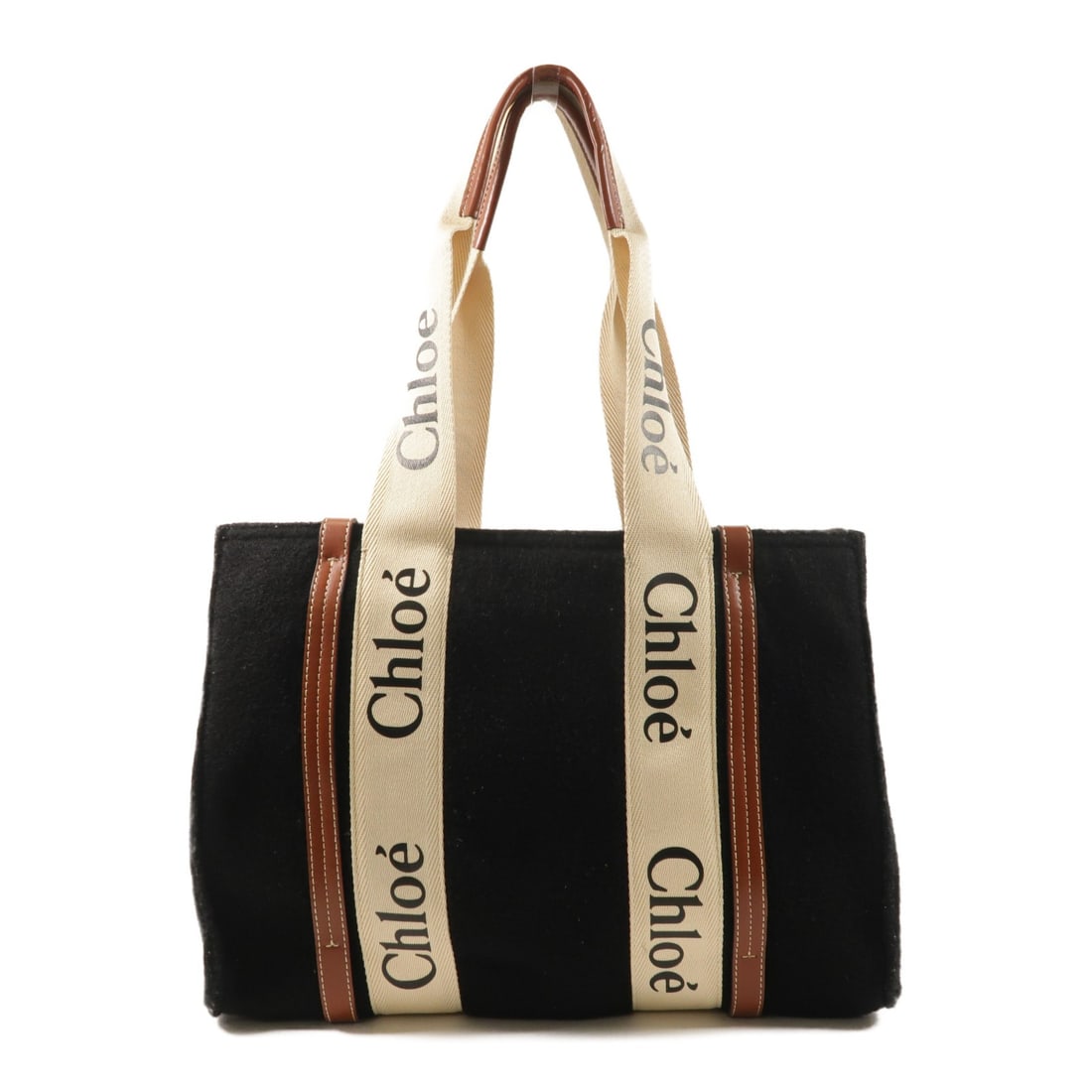 Chloe Woody Black Wool Tote with Gold Hardware: Chloe Woody Black Wool Tote with Gold Hardware This Chloe Woody tote bag features a black wool exterior and is designed for women. The bag offers a spacious interior, making it suitable for daily use.