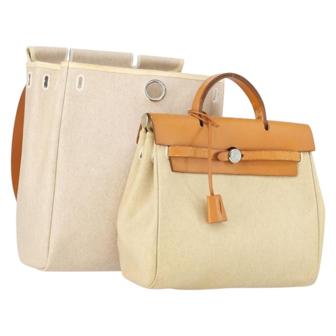 Herbag Ad PM Canvas and Leather Backpack by Hermes in Beige Silver Two Way Style: Herbag Ad PM Canvas and Leather Backpack by Hermes in Beige Silver Two Way Style This Hermes Herbag Ad PM backpack features a two-way design crafted from canvas and leather in beige and silver tones.