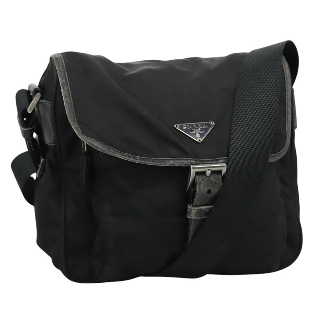 Prada Black Nylon Shoulder Bag with Silver Tone Hardware Italy: Prada Black Nylon Shoulder Bag with Silver Tone Hardware Italy This PRADA shoulder bag features a black nylon exterior with silver accents and is designed for women. Made in Italy, it offers a practic