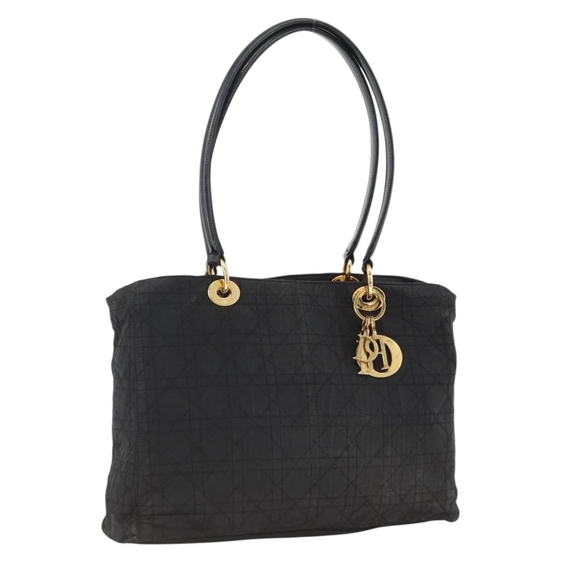 Christian Dior Black Nylon Canage Tote with Gold Accents and Charm: Christian Dior Black Nylon Canage Tote with Gold Accents and Charm This Christian Dior Canage tote bag features a black nylon exterior with gold-tone accents and a decorative charm. Designed for women