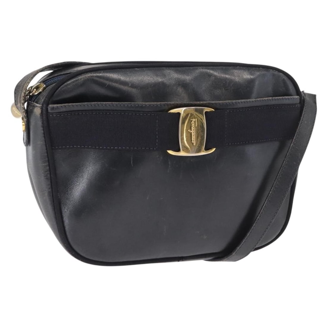 Salvatore Ferragamo Navy Leather Shoulder Bag Gold Tone Hardware Italy: Salvatore Ferragamo Navy Leather Shoulder Bag Gold Tone Hardware Italy This Salvatore Ferragamo shoulder bag is crafted from navy leather with gold-tone accents. Made in Italy, it features a compact d
