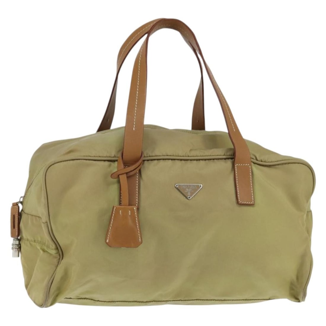 PRADA Beige Silver Nylon Boston Bag with Clochette Made in Italy: PRADA Beige Silver Nylon Boston Bag with Clochette Made in Italy This authentic PRADA Boston Bag is crafted from durable nylon in a chic beige and silver color combination. The bag features a spacious