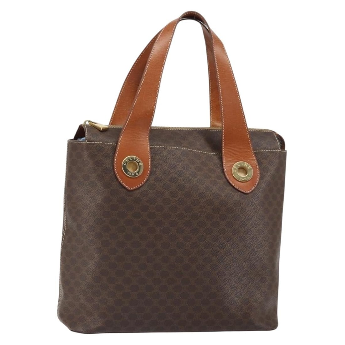 Celine Macadam PVC Leather Brown Gold Handbag Italy: Celine Macadam PVC Leather Brown Gold Handbag Italy This CELINE Macadam hand bag is crafted from PVC leather and Macadam canvas in brown and gold tones. Made in Italy, it features a top handle with an