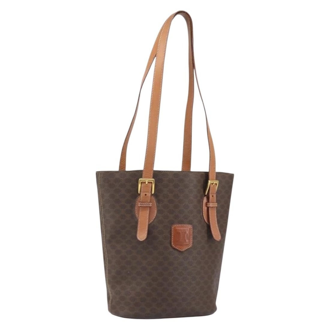 Celine Macadam Brown PVC Leather Tote with Gold Accents: Celine Macadam Brown PVC Leather Tote with Gold Accents This CELINE Macadam Canvas tote bag features a brown and gold color scheme crafted from PVC leather and canvas. The tote is made in Italy and of