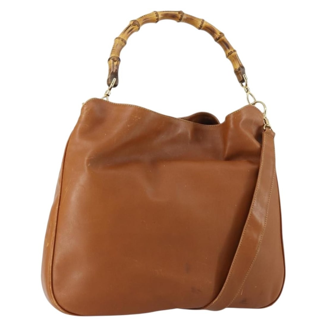 Brown Leather GUCCI Bamboo 2way Shoulder Bag with Gold Accents: Brown Leather GUCCI Bamboo 2way Shoulder Bag with Gold Accents This GUCCI Bamboo shoulder bag is crafted from brown and gold leather and can be carried as a shoulder bag or by hand, offering versatile