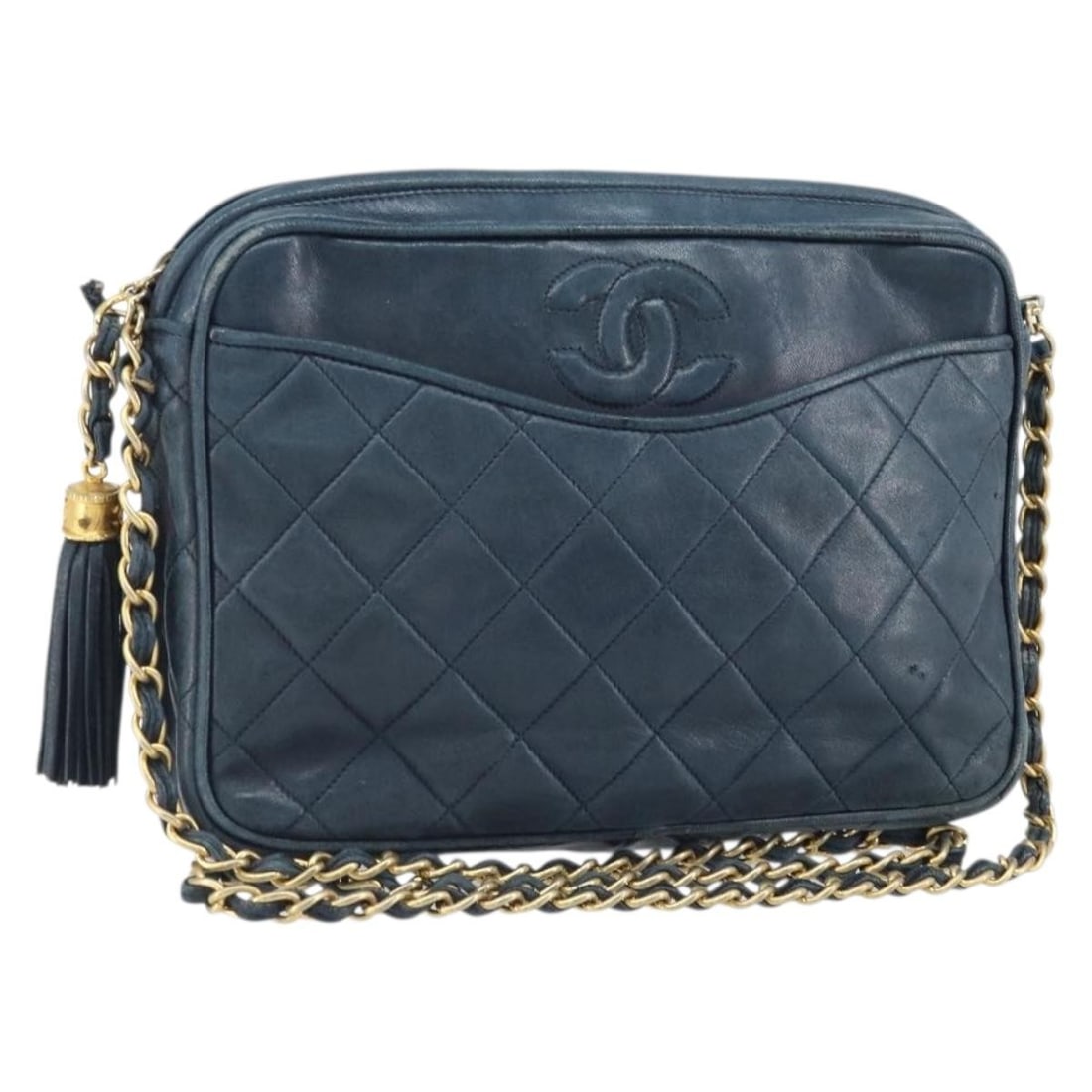Navy Lambskin Chanel Matelasse Shoulder Bag with Gold Chain Strap: Navy Lambskin Chanel Matelasse Shoulder Bag with Gold Chain Strap This Chanel Matelasse shoulder bag features lambskin exterior in navy with gold-tone hardware, crafted in Italy. The bag measures appr