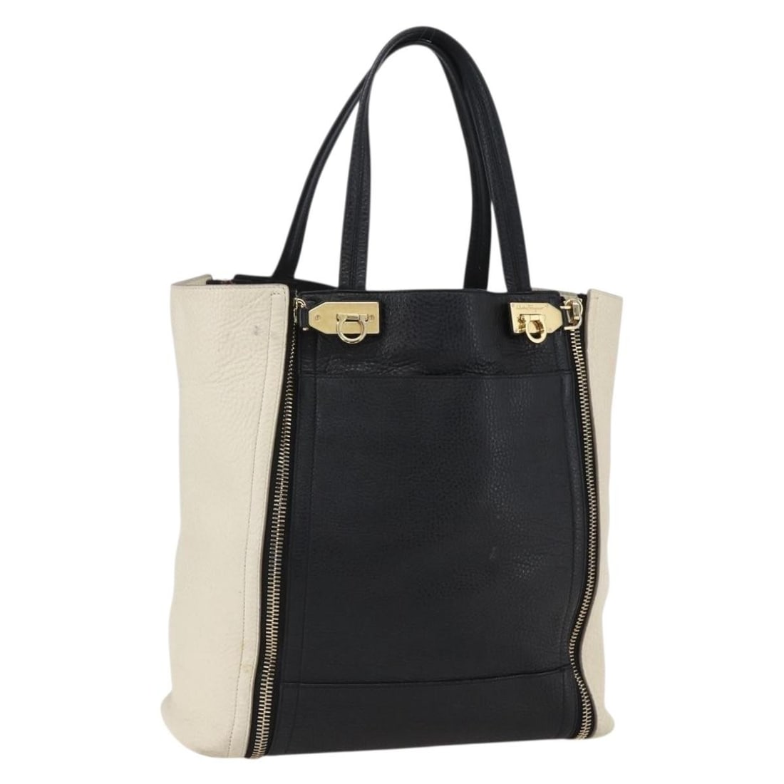 White and Black Leather Tote by Salvatore Ferragamo Italy: White and Black Leather Tote by Salvatore Ferragamo Italy This Salvatore Ferragamo tote bag features a white and black leather exterior and is designed for women. Made in Italy, the bag offers ample s