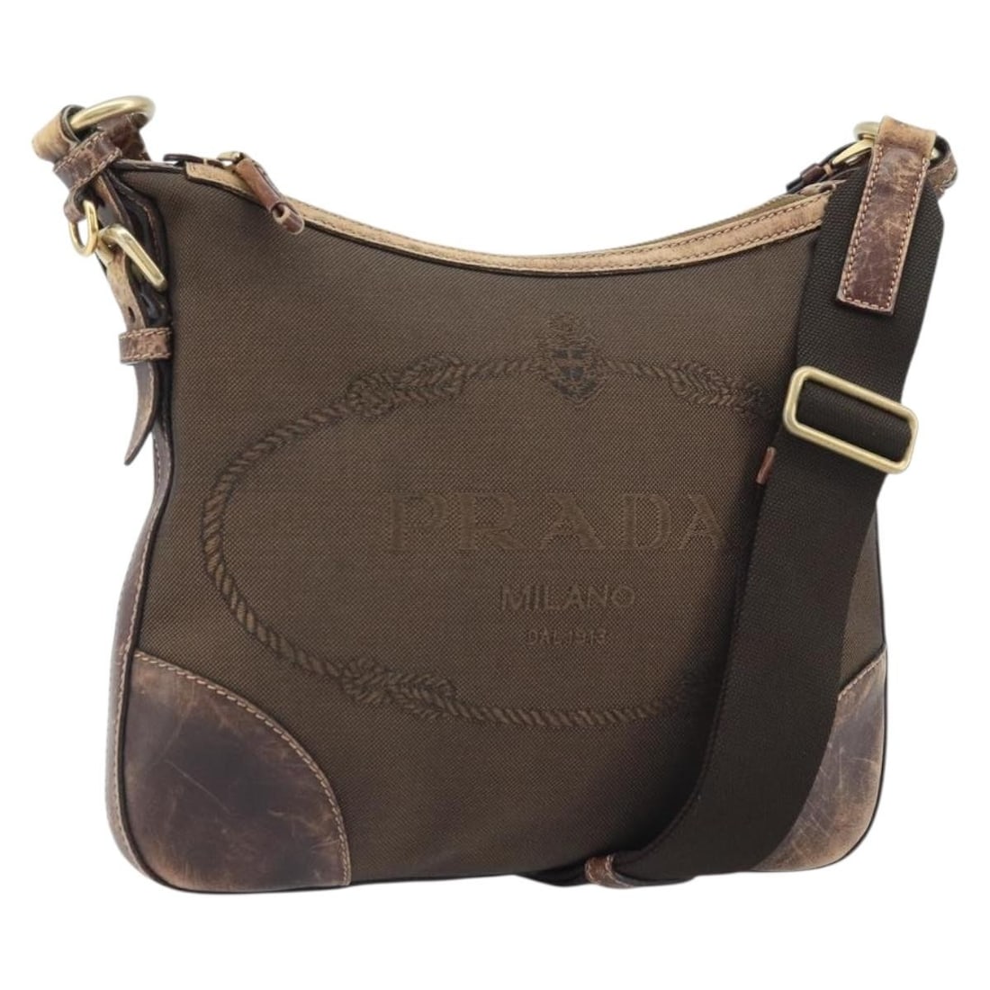 Prada Canvas Brown Gold Women's Shoulder Bag with Name Tag: Prada Canvas Brown Gold Women's Shoulder Bag with Name Tag This PRADA shoulder bag is crafted from brown and gold canvas and is designed for women. The bag features a spacious main compartment, a name